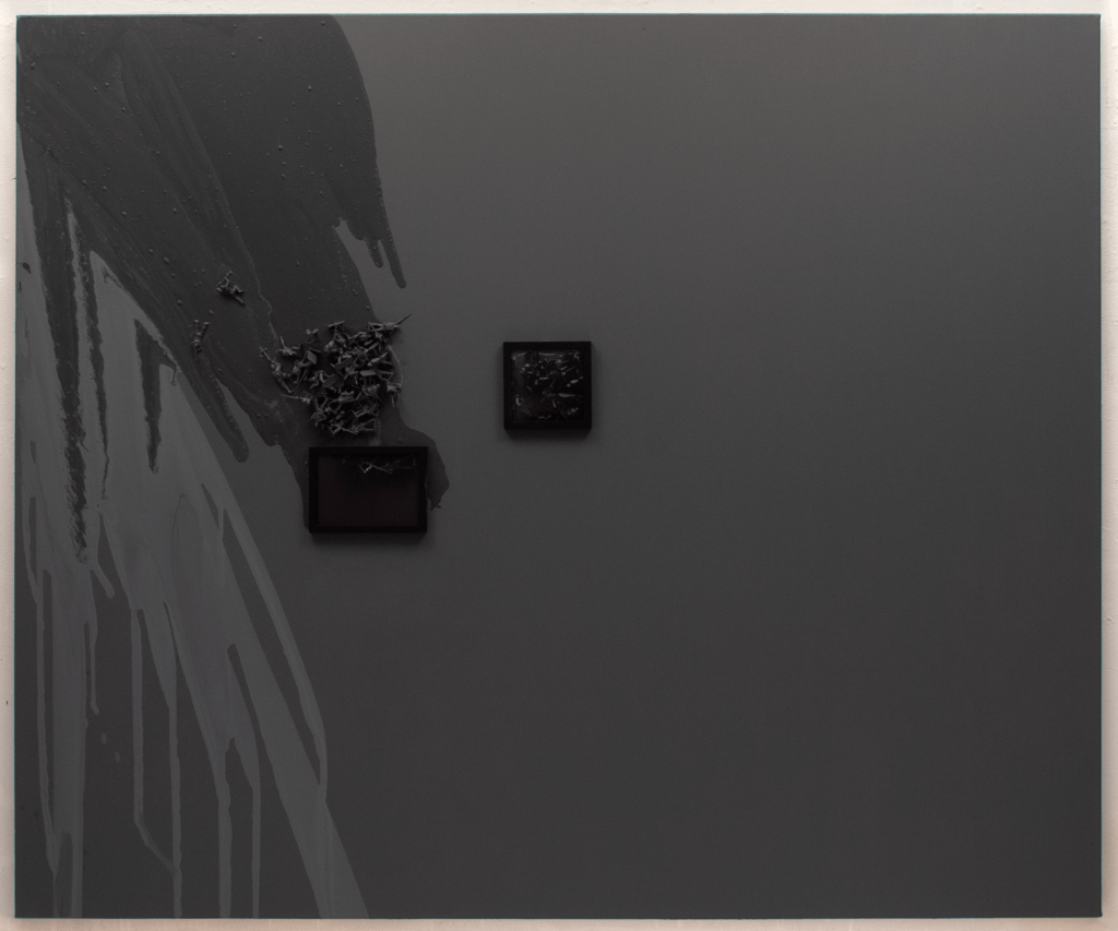 A large canvas painted gray with two black frames that enclose digital images of the toy soldiers that appear in a spill of a light and dark gray paint across the left side of the painting. 